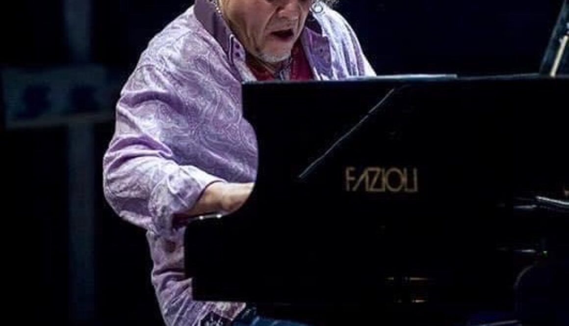 A man sitting at the piano playing something