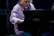 A man sitting at the piano playing something